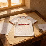 Camiseta Iberia Blanca Meridiano 26 - frontal de producto con la cartografía dorada